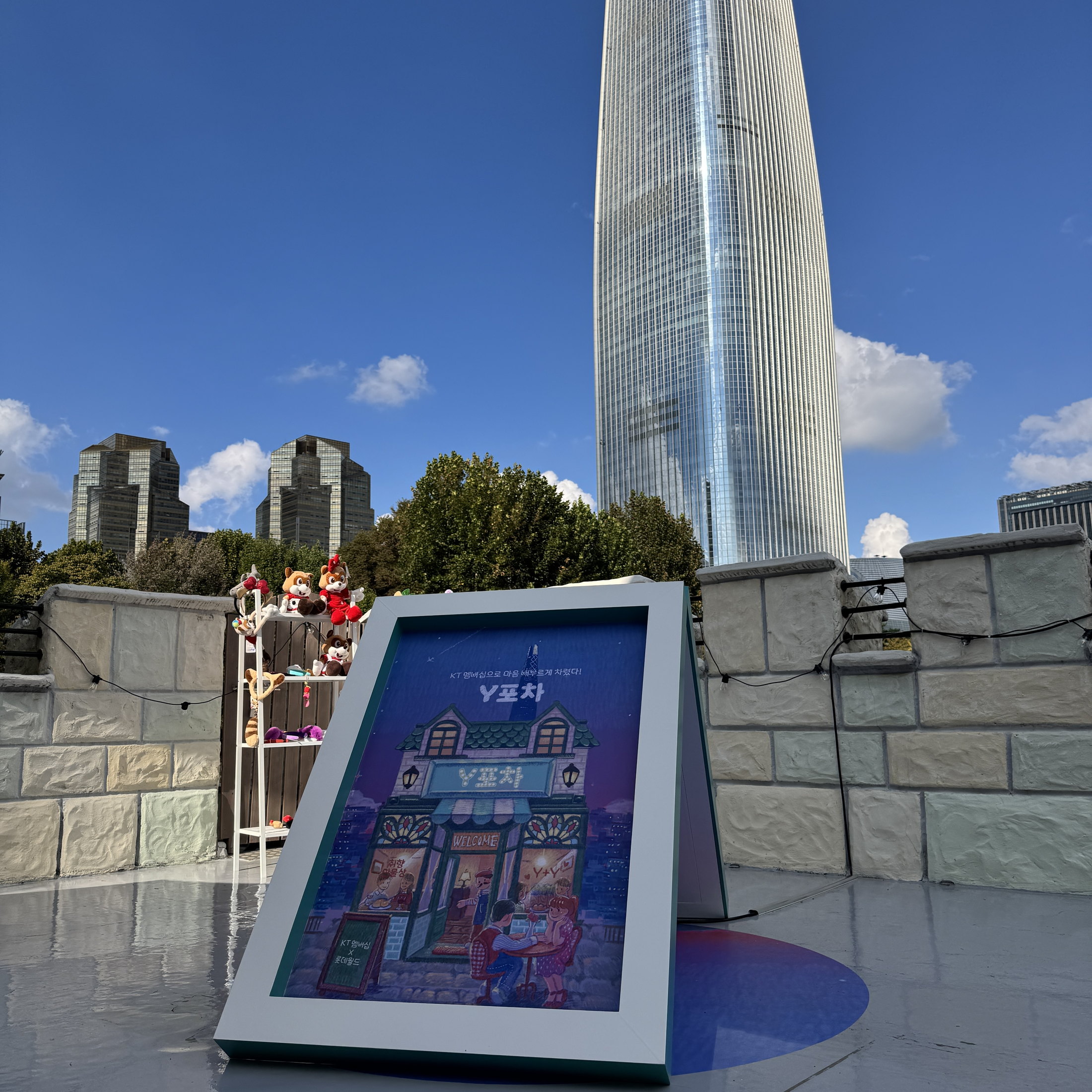 Large-scale Y Pocha key visual display at the pop-up site.